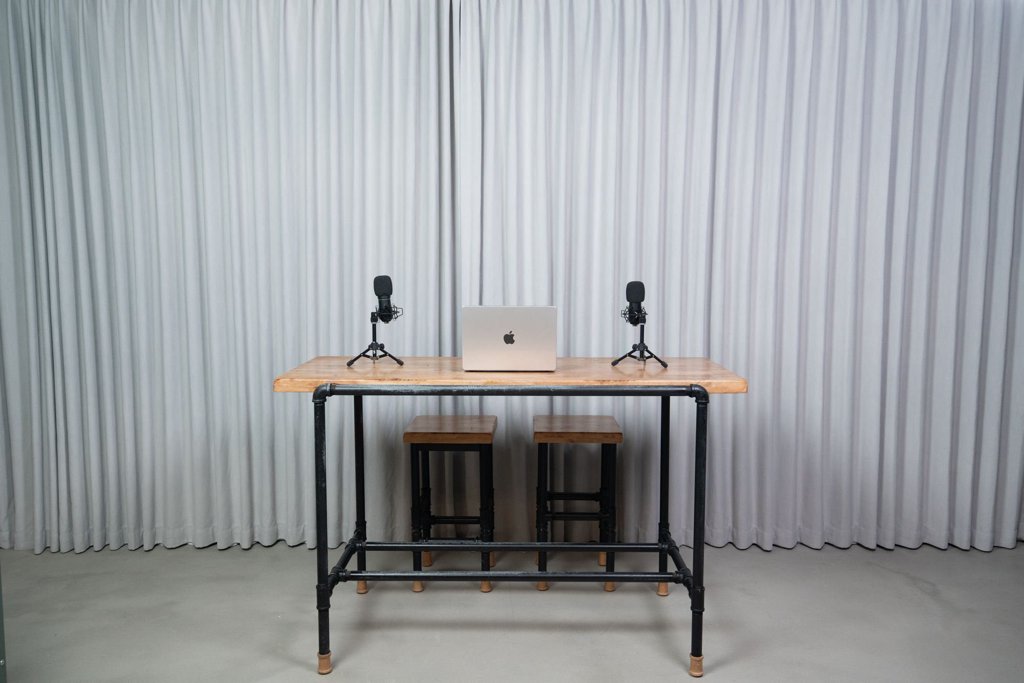 Standing podcast table with microphones